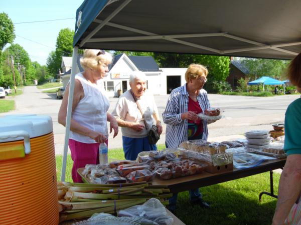 5/28/16 Josh Lussier, Helen Renaud and Jeannine Young prepare the table for our annual bake sale held during the Hardwick Spring Festival.