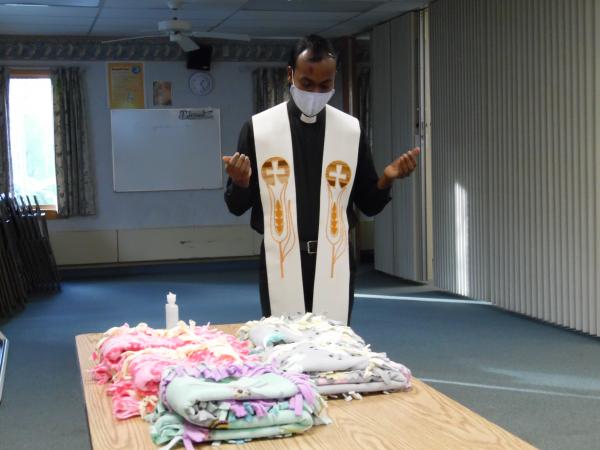Court Chaplain Fr. Thomas Aquinas blesses prayer blankets at the June 3, 2021 meeting.
